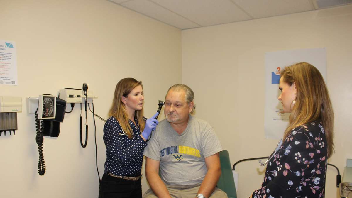 Preceptor and student with patient.
